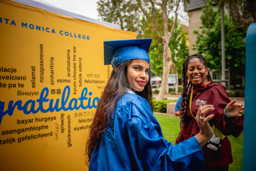 beautiful young woman in graduation robes