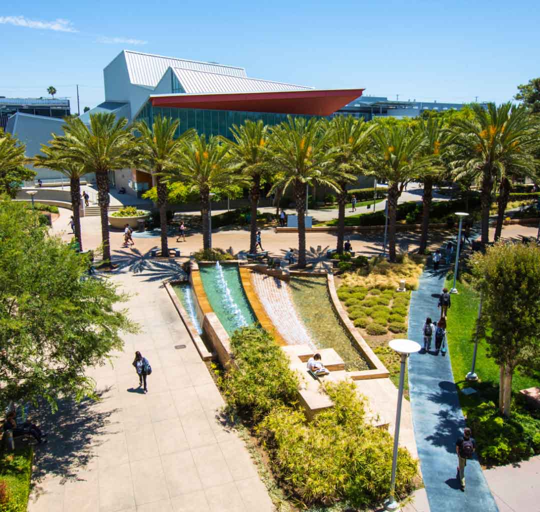 aerial view of campus with palm trees and fountains