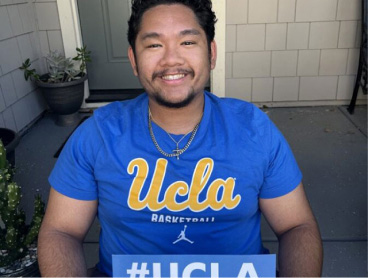 Smiling man with a UCLA shirt