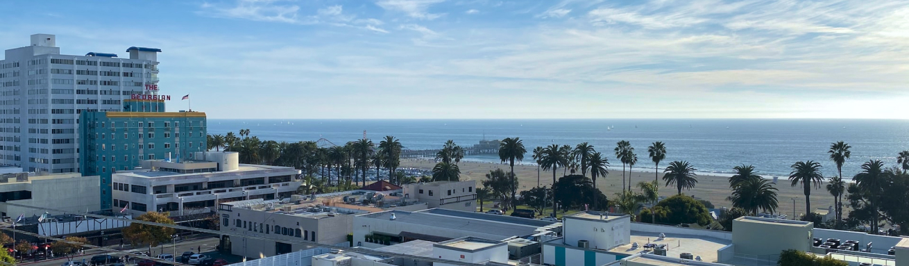 beautiful sandy beach and tall city buildings